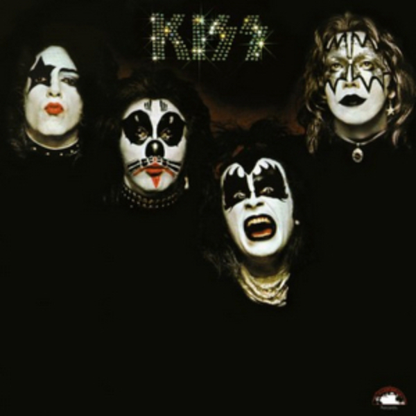 Kiss 1st album. Black background the painted faces of the members of Kiss in each quadrant with their logo on top in the middle